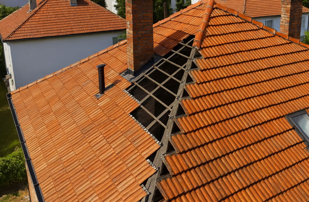 Roof with missing tiles after a storm