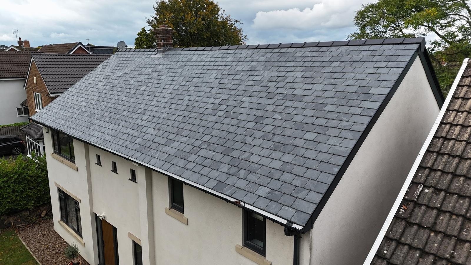 New slate roof on a rendered house