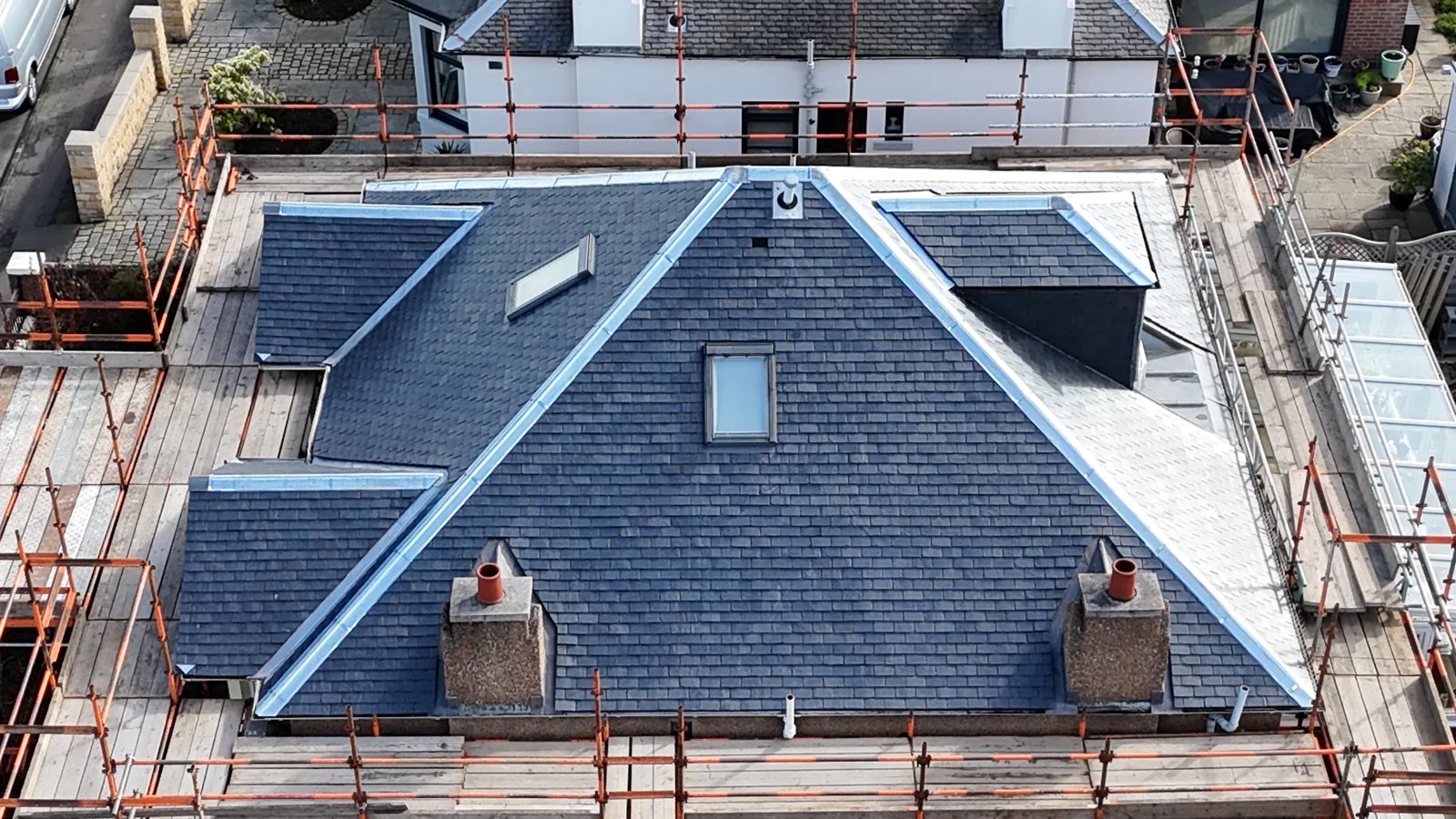 New slate roof completed with scaffolding
