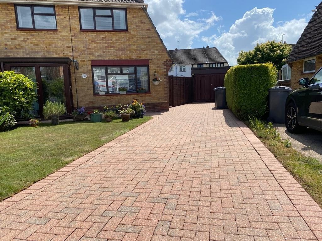 Clean block-paved driveway leading to a UK semi-detached house